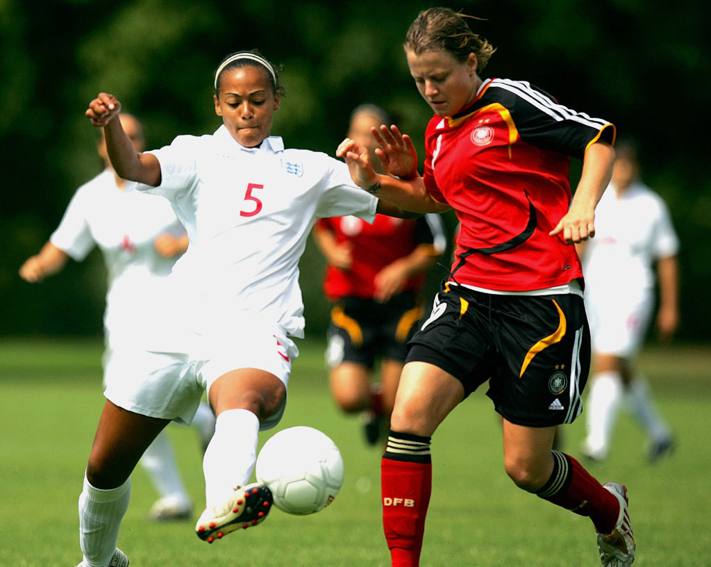 Everton defender Fern Whelan wins the ball cleanly against Germany.